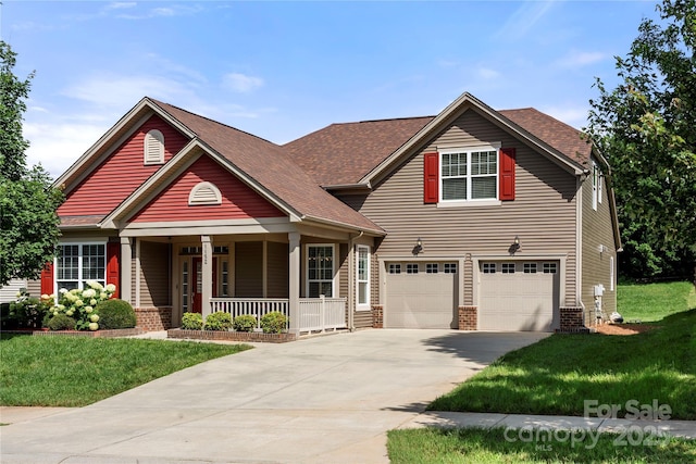 1152 Mckee Farm Ln, Belmont, NC 28012 - view of front of house featuring a porch, driveway, an attached garage, and a front lawn