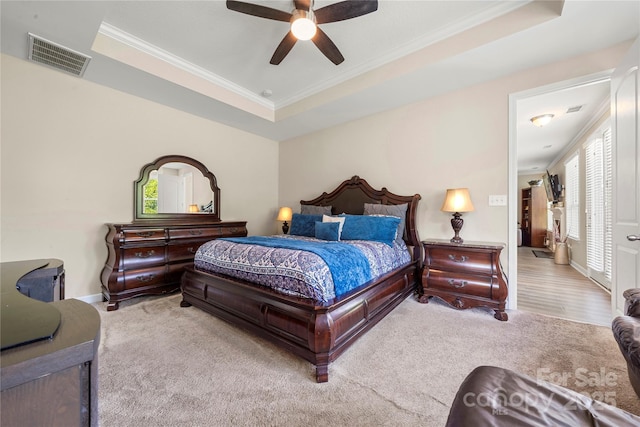 1152 Mckee Farm Ln, Belmont, NC 28012 - carpeted bedroom with ornamental molding, a tray ceiling, and ceiling fan