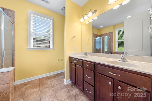 1152 Mckee Farm Ln, Belmont, NC 28012 - bathroom featuring double vanity, a shower stall, and tile patterned floors