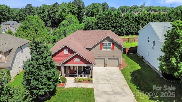1152 Mckee Farm Ln, Belmont, NC 28012 - view of front of property featuring concrete driveway, covered porch, a front lawn, and a garage