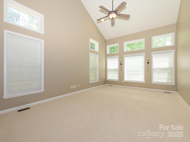 9212 John Hawks Rd, Cornelius, NC 28031 - spare room with high vaulted ceiling, ceiling fan, and light colored carpet