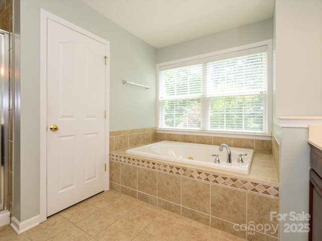 9212 John Hawks Rd, Cornelius, NC 28031 - bathroom featuring tile patterned flooring, a whirlpool tub, plenty of natural light, and vanity