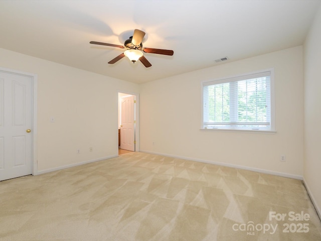 9212 John Hawks Rd, Cornelius, NC 28031 - spare room featuring light colored carpet and ceiling fan