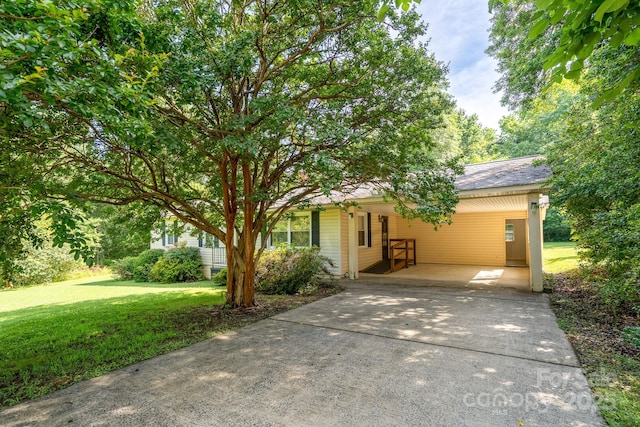 4022 Price Short Cut Rd, Monroe, NC 28110 - view of front of house with driveway, a carport, and a front yard