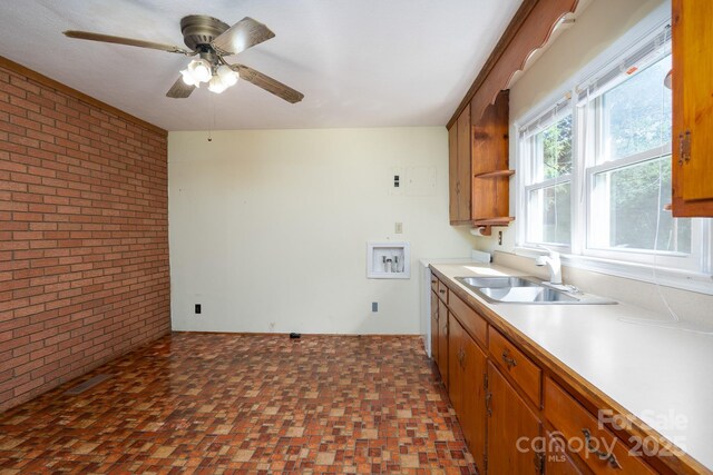 4022 Price Short Cut Rd, Monroe, NC 28110 - kitchen with brick wall, brown cabinets, a ceiling fan, and light countertops