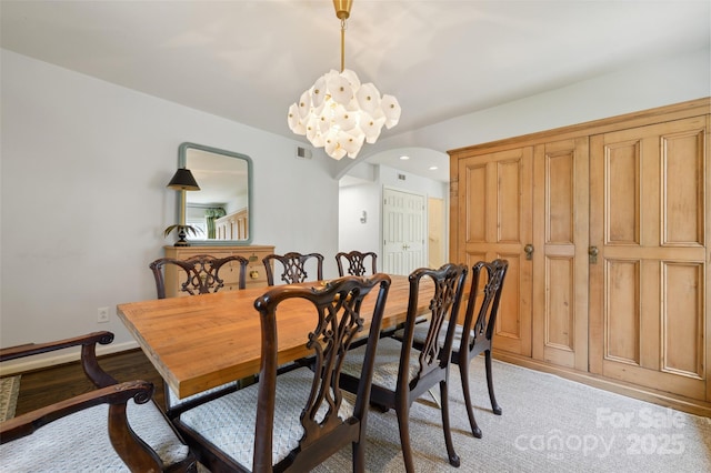 1040 Goshen Pl, Charlotte, NC 28211 - dining area featuring arched walkways, light wood-type flooring, and recessed lighting