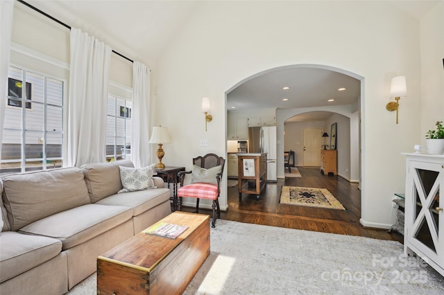 1040 Goshen Pl, Charlotte, NC 28211 - living area featuring arched walkways, dark wood-style flooring, recessed lighting, and high vaulted ceiling
