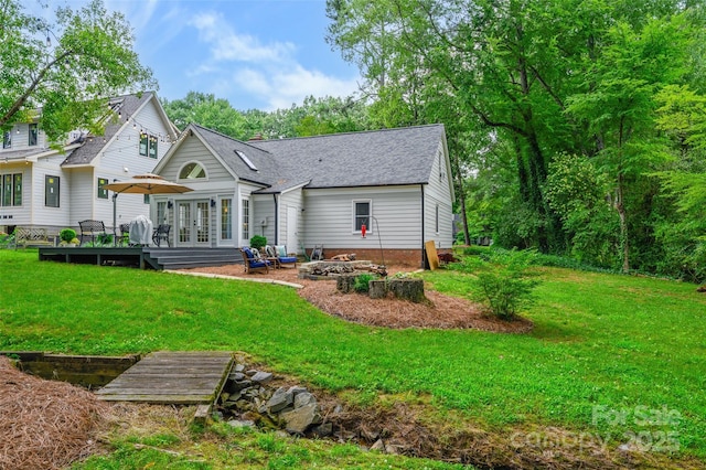 1040 Goshen Pl, Charlotte, NC 28211 - back of house with an outdoor fire pit, a deck, french doors, a yard, and roof with shingles