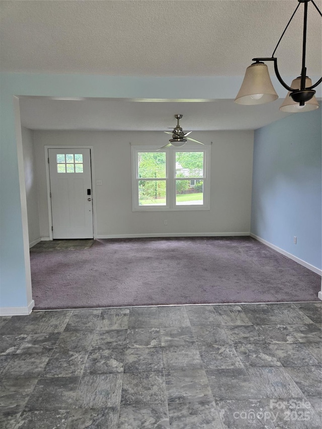 125 Heritage View Rd, Hickory, NC 28601 - carpeted entryway featuring ceiling fan and a textured ceiling