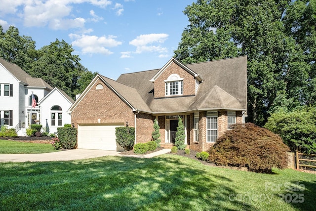 19509 Trintella Ln, Cornelius, NC 28031 - traditional-style house featuring brick siding, a garage, driveway, and roof with shingles