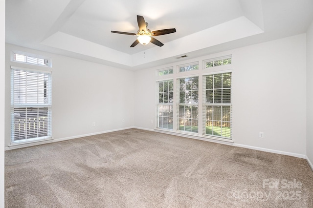 19509 Trintella Ln, Cornelius, NC 28031 - empty room featuring a tray ceiling, carpet, and a ceiling fan