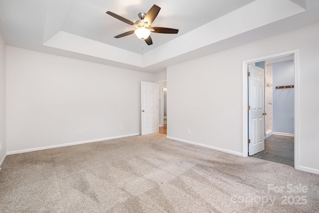 19509 Trintella Ln, Cornelius, NC 28031 - unfurnished bedroom with carpet, a raised ceiling, ensuite bathroom, and a ceiling fan