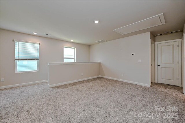 1410 31st St NE, Conover, NC 28613 - carpeted spare room with attic access and recessed lighting