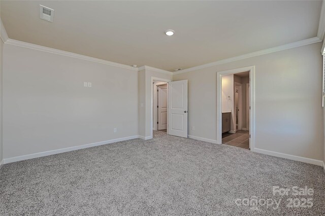 1410 31st St NE, Conover, NC 28613 - unfurnished bedroom with crown molding, carpet, and ensuite bath