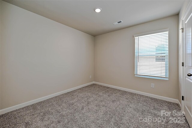 1442 31st St NE, Conover, NC 28613 - carpeted empty room with baseboards