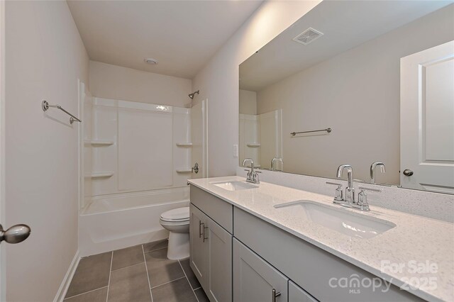 1442 31st St NE, Conover, NC 28613 - full bath featuring double vanity, tile patterned flooring, and washtub / shower combination