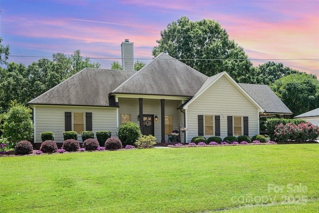 5701 Cedar Hill Dr, Monroe, NC 28110 - view of front of home with a chimney, a yard, and a shingled roof