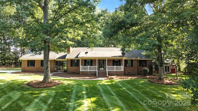 4323 Crow Rd, Monroe, NC 28112 - view of front of house with covered porch, a front yard, crawl space, and brick siding