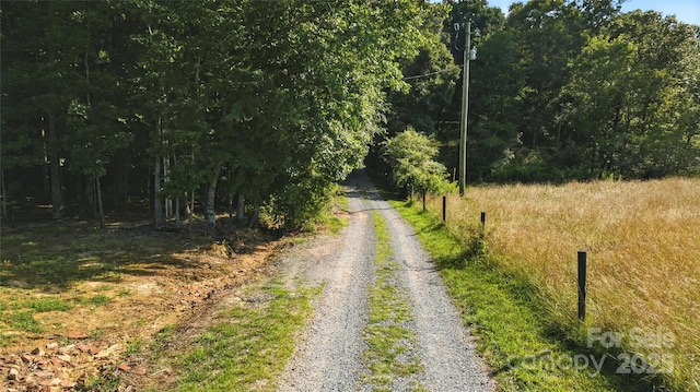 4323 Crow Rd, Monroe, NC 28112 - view of dirt / gravel road with a wooded view