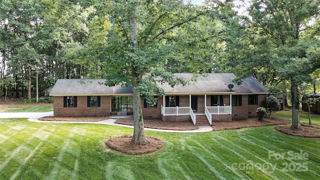 4323 Crow Rd, Monroe, NC 28112 - single story home featuring a porch, a front yard, brick siding, and crawl space