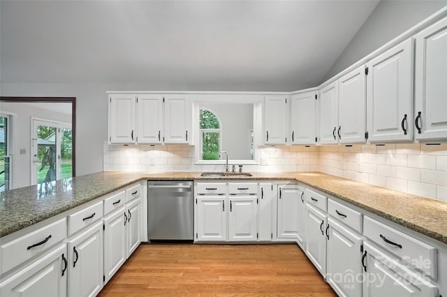 4323 Crow Rd, Monroe, NC 28112 - kitchen featuring dishwasher, healthy amount of natural light, light wood finished floors, vaulted ceiling, and white cabinets