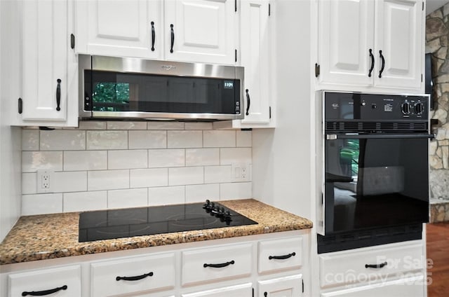 4323 Crow Rd, Monroe, NC 28112 - kitchen featuring black appliances, decorative backsplash, white cabinets, and stone counters