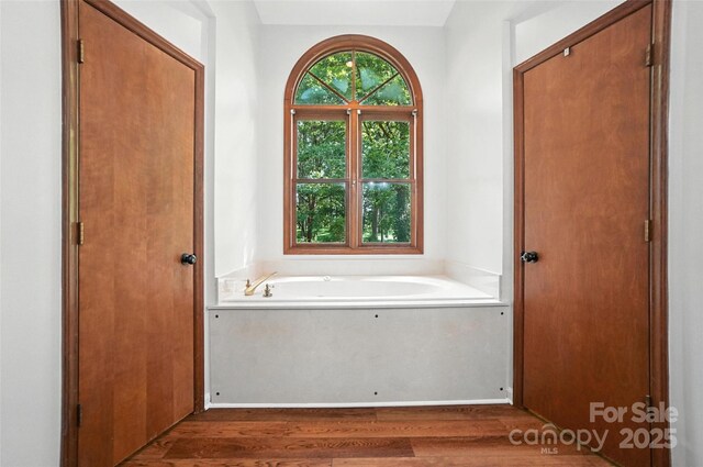 4323 Crow Rd, Monroe, NC 28112 - bathroom featuring wood finished floors and a garden tub