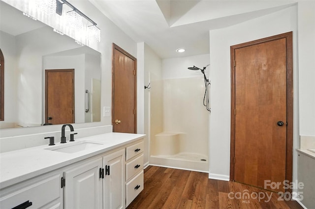 4323 Crow Rd, Monroe, NC 28112 - full bath featuring vanity, a shower, wood finished floors, and recessed lighting