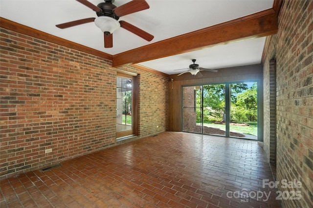 4323 Crow Rd, Monroe, NC 28112 - spare room with brick wall, a ceiling fan, brick floors, and beamed ceiling