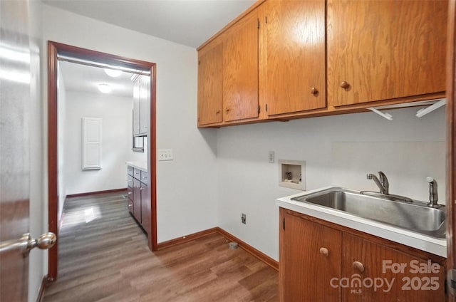 4323 Crow Rd, Monroe, NC 28112 - laundry room featuring cabinet space, hookup for a washing machine, and wood finished floors
