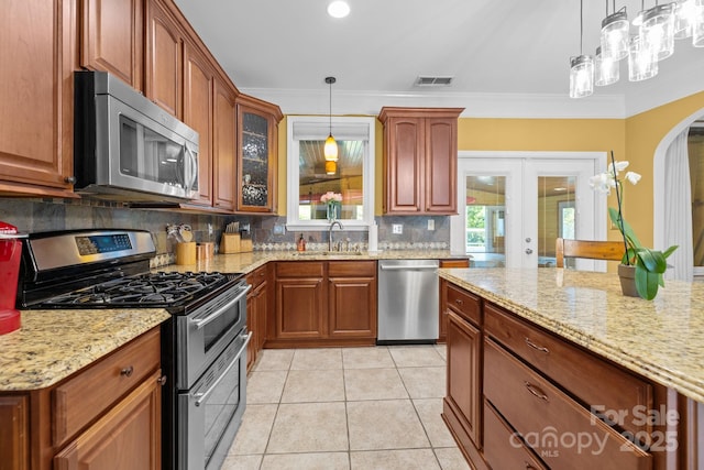 13934 Kings Carriage Ln, Charlotte, NC 28278 - kitchen featuring stainless steel appliances, light stone countertops, tasteful backsplash, french doors, and light tile patterned flooring