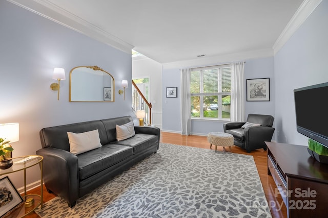 13934 Kings Carriage Ln, Charlotte, NC 28278 - living room with crown molding, wood finished floors, and stairs
