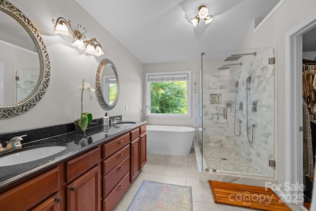 13934 Kings Carriage Ln, Charlotte, NC 28278 - full bath featuring a stall shower, double vanity, a freestanding bath, tile patterned flooring, and a spacious closet