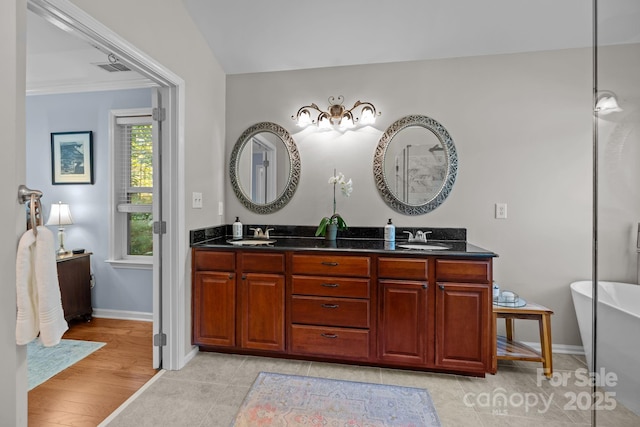 13934 Kings Carriage Ln, Charlotte, NC 28278 - full bathroom with double vanity and a freestanding bath