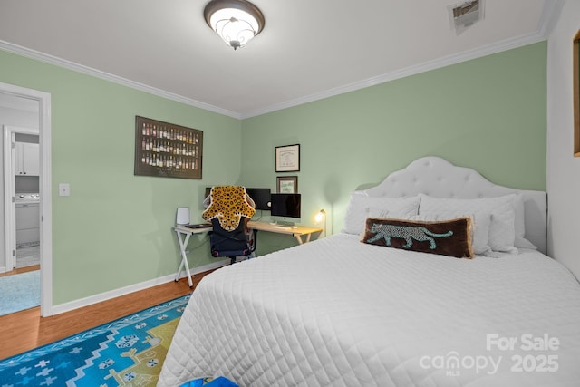 13934 Kings Carriage Ln, Charlotte, NC 28278 - bedroom featuring ornamental molding, wood finished floors, and washer / dryer