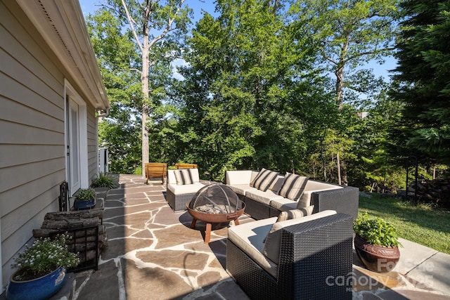 13934 Kings Carriage Ln, Charlotte, NC 28278 - view of patio / terrace with an outdoor living space with a fire pit and view of scattered trees
