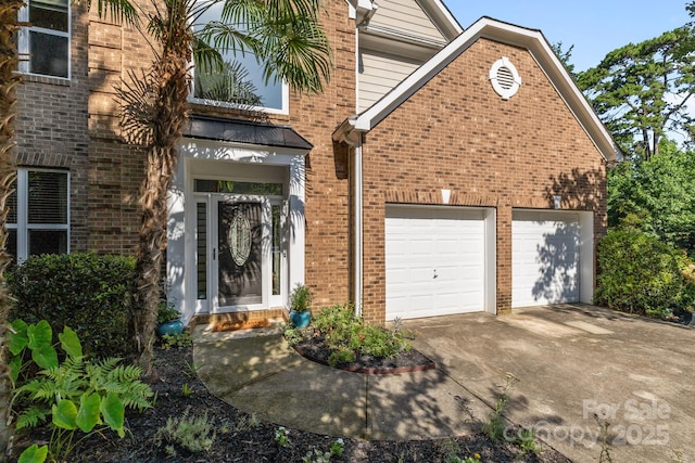 13934 Kings Carriage Ln, Charlotte, NC 28278 - doorway to property featuring brick siding, driveway, and an attached garage