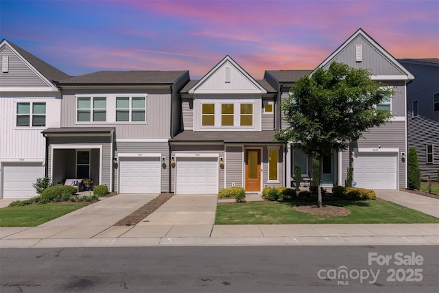 9221 Widden Way, Charlotte, NC 28269 - view of property featuring driveway, board and batten siding, a garage, and a yard