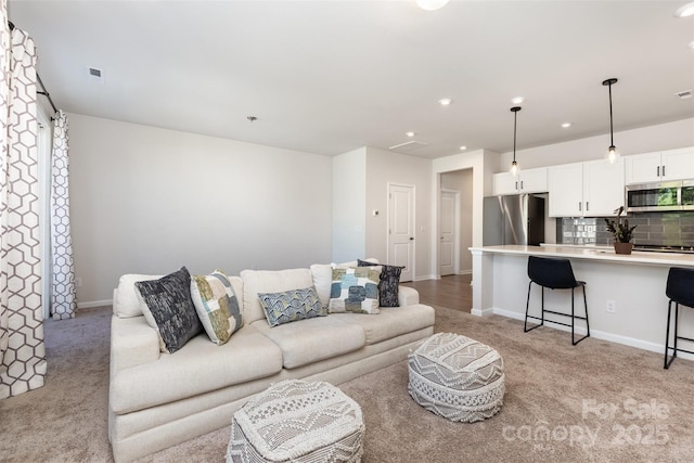 9221 Widden Way, Charlotte, NC 28269 - living room featuring recessed lighting and light colored carpet