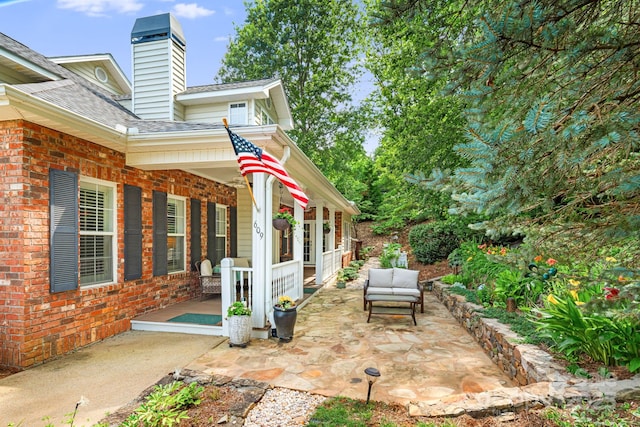 609 Carriage Commons Dr, Hendersonville, NC 28791 - covered porch with outdoor lounge area