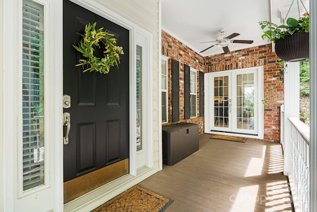 609 Carriage Commons Dr, Hendersonville, NC 28791 - property entrance featuring ceiling fan, brick siding, french doors, and covered porch