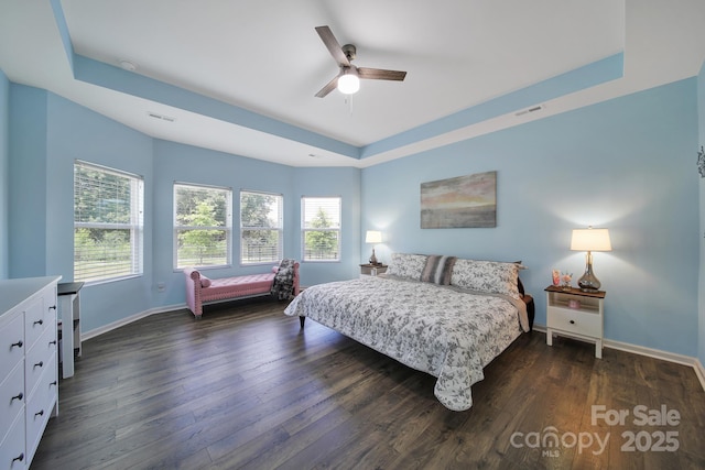 440 Shallowford Dr, Rock Hill, SC 29732 - bedroom featuring a raised ceiling, multiple windows, dark wood-type flooring, and a ceiling fan