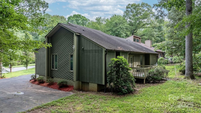 1748 4th Street Ct NE, Hickory, NC 28601 - view of home's exterior featuring a lawn, a chimney, and roof with shingles