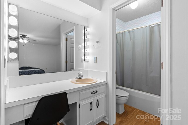 1748 4th Street Ct NE, Hickory, NC 28601 - bathroom featuring vanity, wood finished floors, shower / tub combo, and a ceiling fan