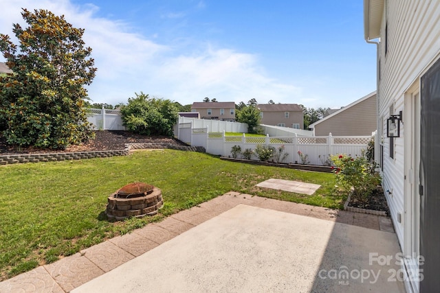 1901 Summit Ridge Ln, Kannapolis, NC 28083 - fenced backyard with a fire pit and a patio area