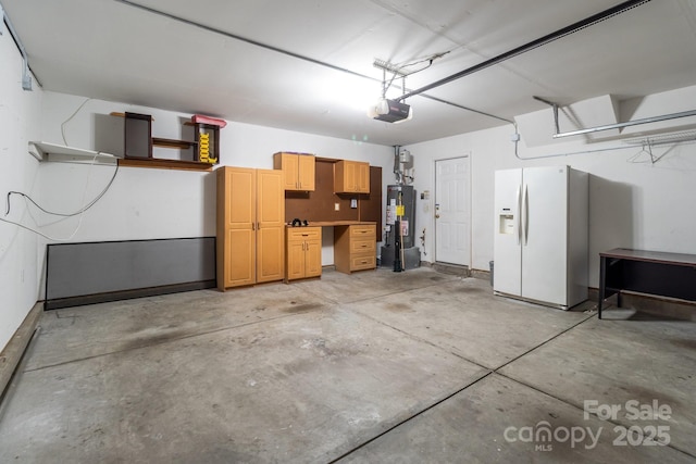 1901 Summit Ridge Ln, Kannapolis, NC 28083 - garage with water heater, white refrigerator with ice dispenser, and a garage door opener