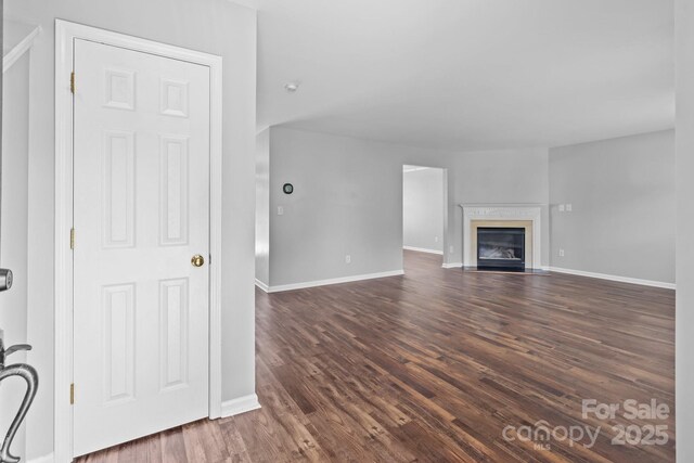 1901 Summit Ridge Ln, Kannapolis, NC 28083 - unfurnished living room with dark wood-style floors and a fireplace with flush hearth