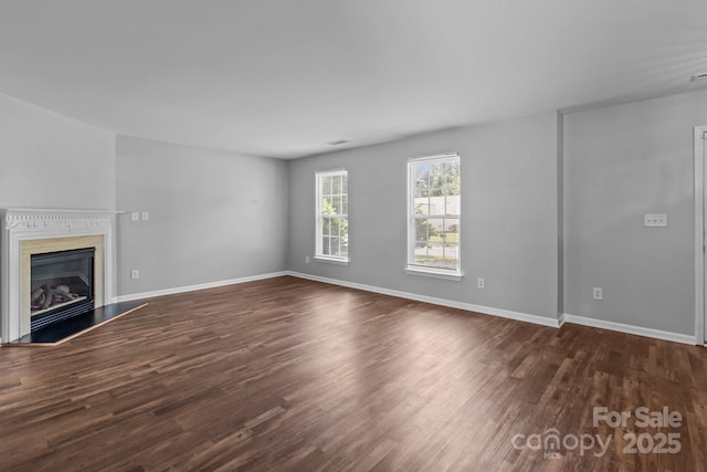 1901 Summit Ridge Ln, Kannapolis, NC 28083 - unfurnished living room with dark wood-type flooring and a glass covered fireplace