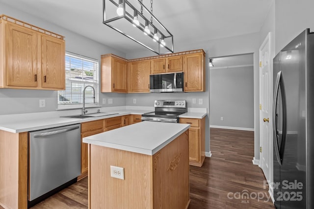 1901 Summit Ridge Ln, Kannapolis, NC 28083 - kitchen with appliances with stainless steel finishes, dark wood-style flooring, light countertops, and a center island