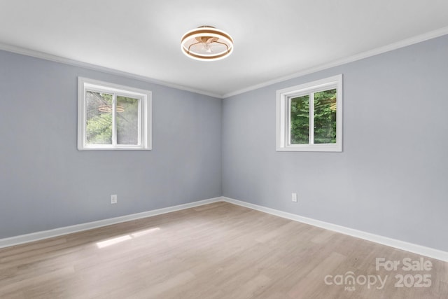 1175 Bamboo Rd, Boone, NC 28607 - empty room with ornamental molding and light wood-style floors